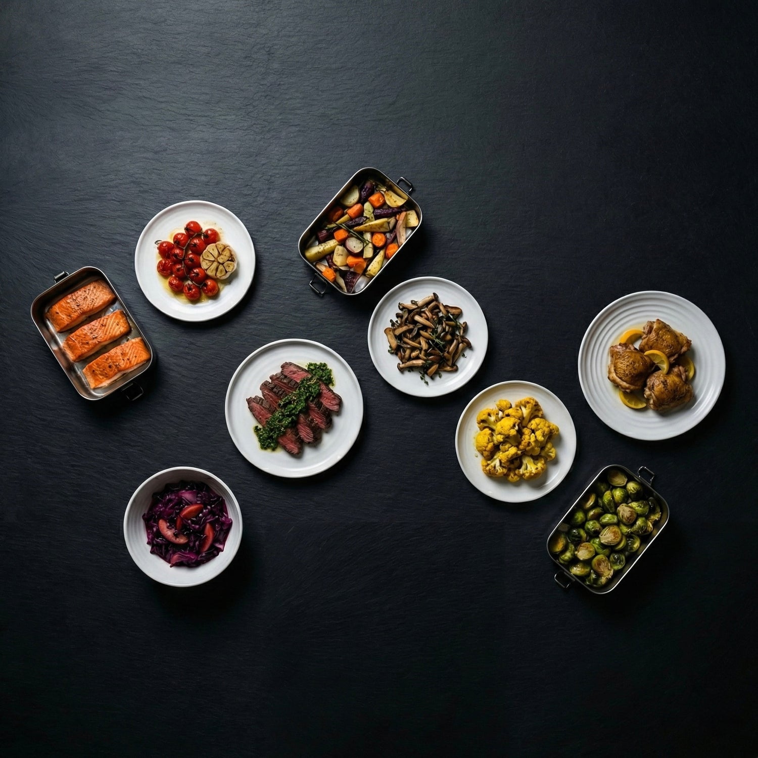 Assorted dishes of food including vegetables, meats, and grains on a dark surface